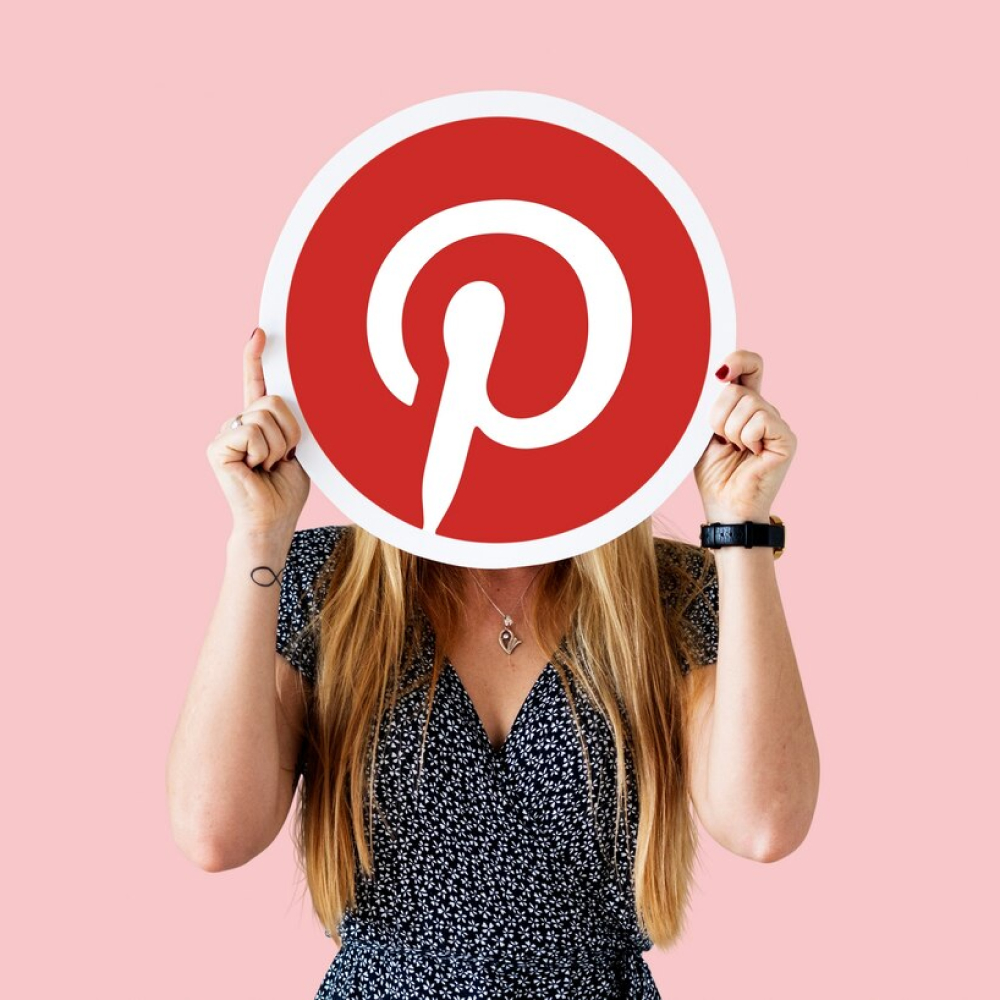 woman-showing-pinterest-icon_53876-40589 1 liatto-pinterest-management-service