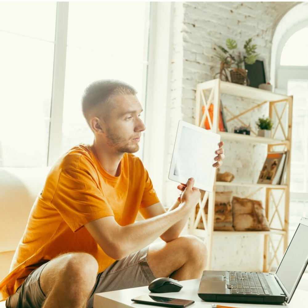 young-caucasian-male-blogger-with-professional-camera-recording-video-review-tablet-home_155003-26972 (2)